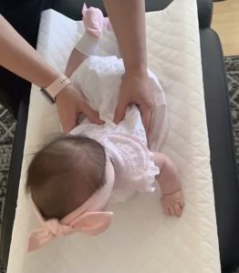 Chiropractor adjusting baby spine